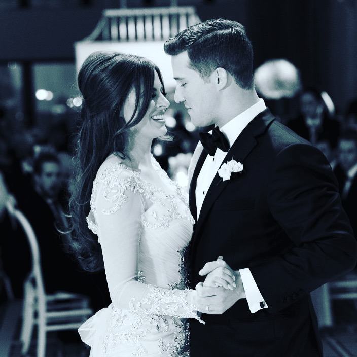 A man and woman dancing at their wedding.